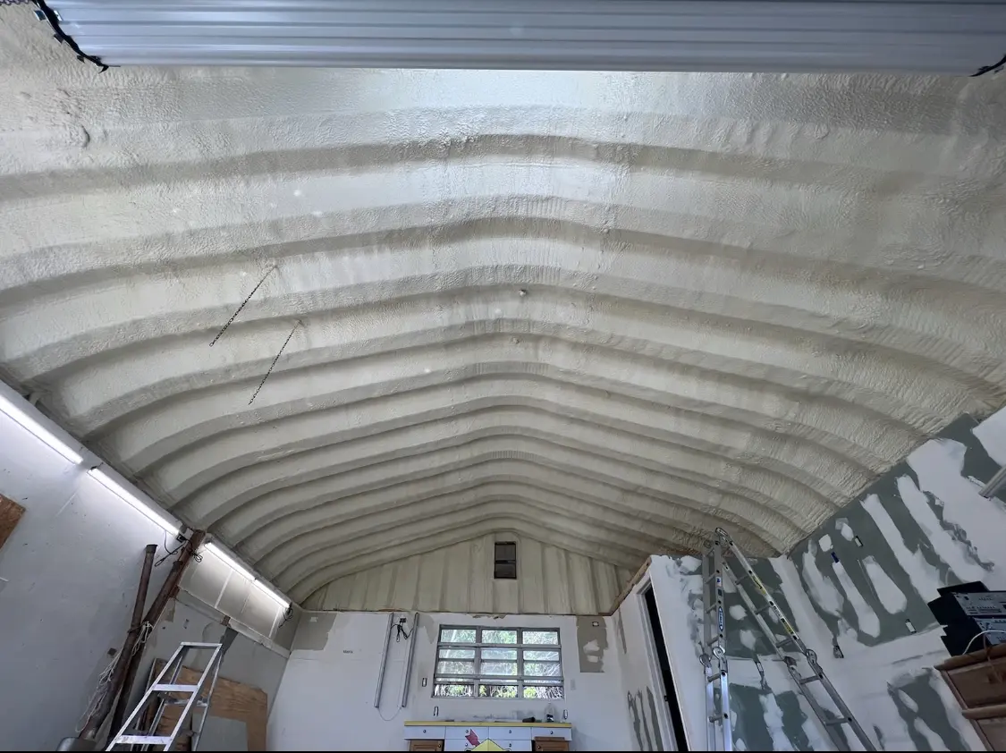 Spray polyurethane foam applied to the underside of a metal roof deck in Vancouver